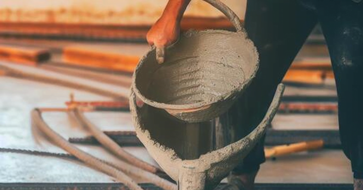 concrete pouring man bucket